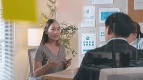 Professional Asian executive explaining complex data visualization on a screen to his coworkers. A collaborative team meeting focused on digital analytics, strategy, and business growth success - Powered by Shutterstock - Get 15% off with code: PIKWIZARD15