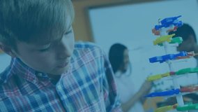 Animation of neon shapes over caucasian schoolboy with model. school and education concept digitally generated video. - Powered by Shutterstock - Get 15% off with code: PIKWIZARD15