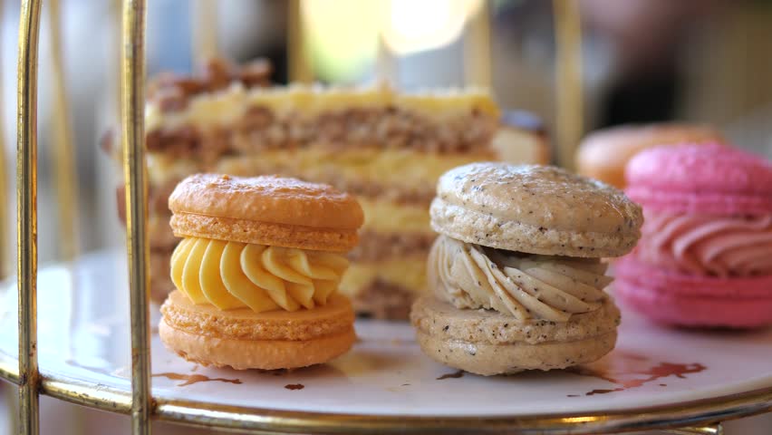 Assorted Dessert Cakes and Mini Pastries on Elegant Serving Tray, Cafe Style Close Up