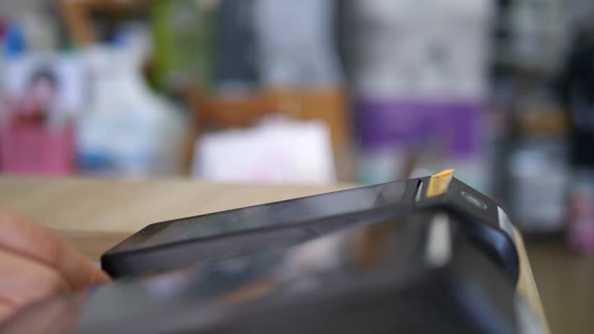 Credit Card Swipe Payment on POS Terminal, Modern Retail Cashless Transaction