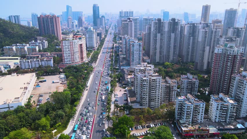 This 4K aerial time-lapse video features Zhuhai’s vibrant urban charm, showcasing iconic modern architecture, landmark CBD skyline, spectacular coastal bridges and smooth urban traffic flow. Capturing the dynamic panoramic scenery of this southern Chinese coastal city’s core center, it perfectly presents the integration of modern urban construction and coastal traffic landscape, ideal for urban tourism and city promotion content.