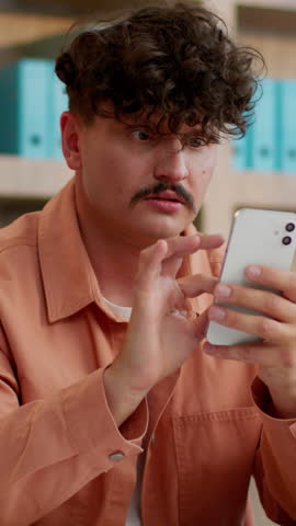 Irritated annoyed European business man lose with mobile phone loser businessman Caucasian distress male guy suffering with smartphone failure bet fail lost money debt feeling anger furious in office