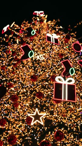 Christmas tree with glowing neon holiday icons
