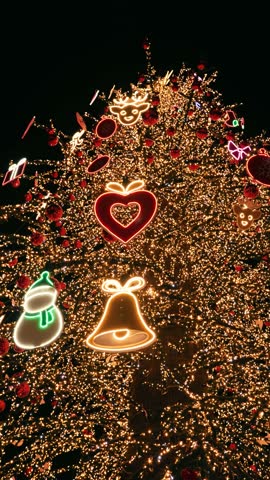 Christmas tree with glowing neon holiday icons