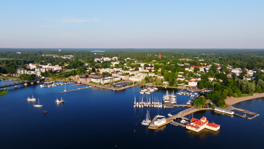 Establishing drone shot of the seafront of Tammisaari city, summer eve in Finland