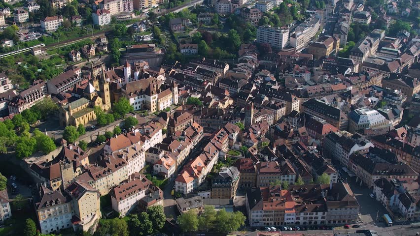 Panoramic aerial of the old town of the city Neuchatel or Neuburg in Switzerland on a sunny noon in summer
