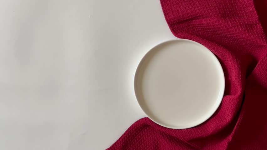 Plating and Eating Chocolate-Stuffed Donut on White Plate