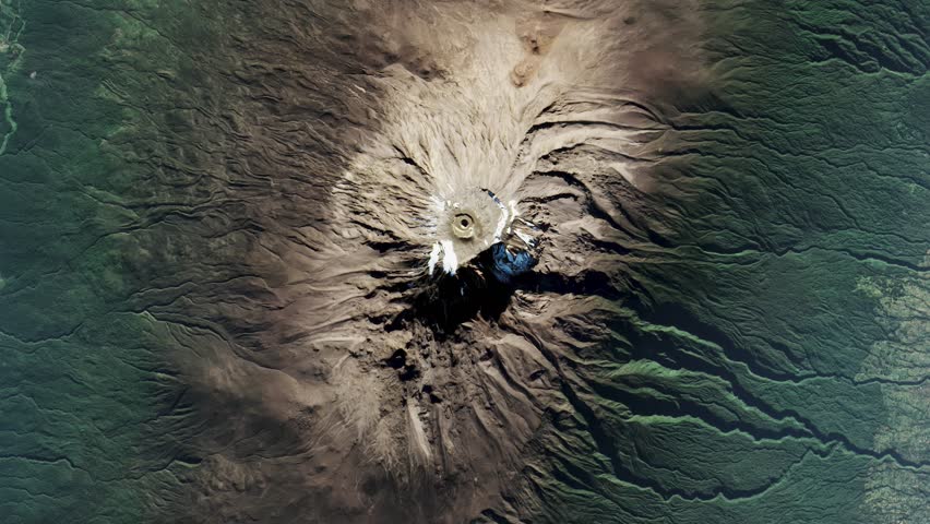 Top view on Kilimanjaro volcano surrounded by jungles. Camera is zooming in, rotating counterclockwise. Animation based on image by NASA