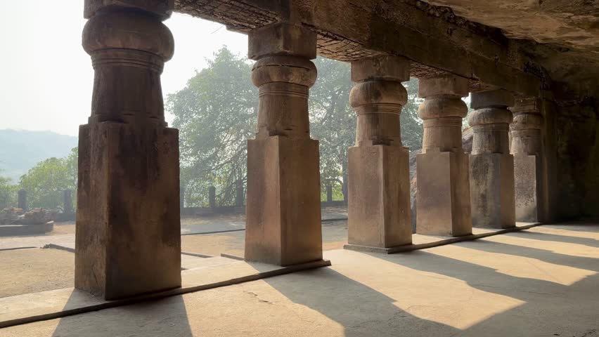 Rock-cut temple colonnade at Elephanta Caves on Elephanta Island, Mumbai Harbor, Maharashtra, India.
