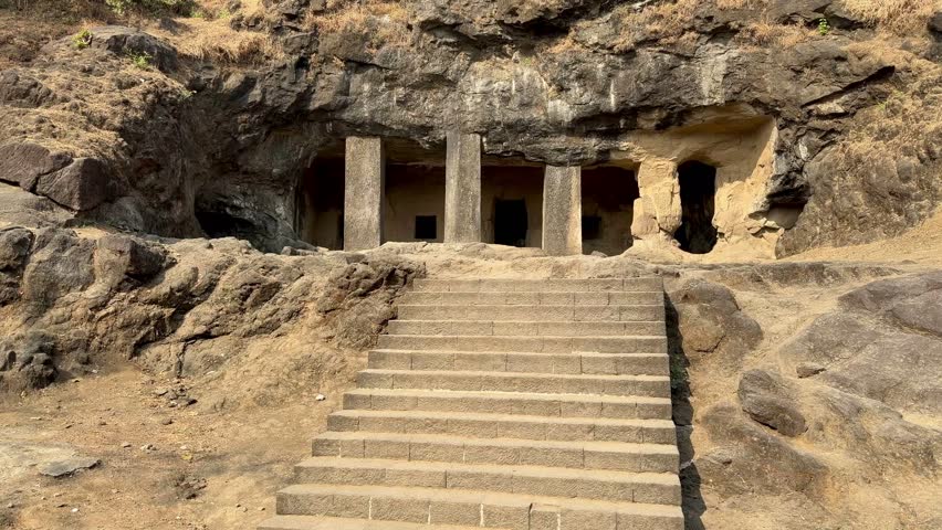 Rock-cut temple colonnade at Elephanta Caves on Elephanta Island, Mumbai Harbor, Maharashtra, India.