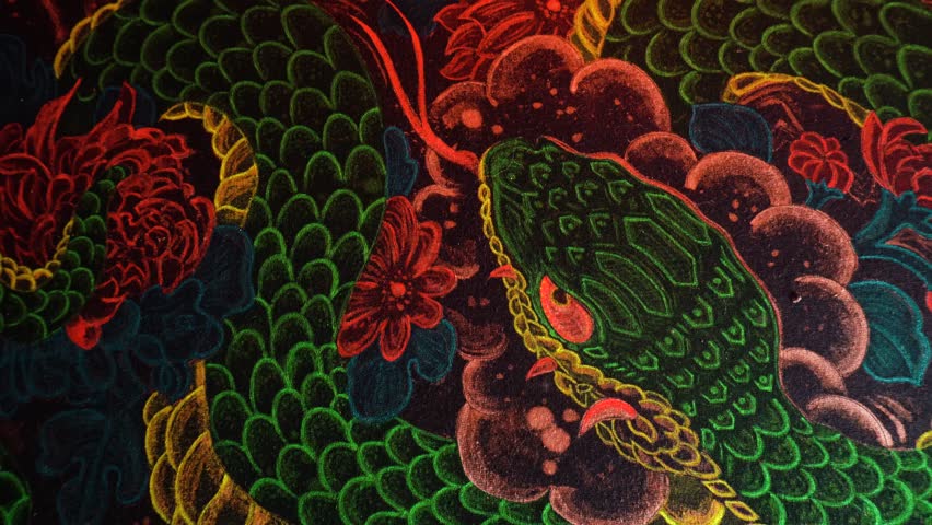painting of the year of the snake with acrylic paints on fabric