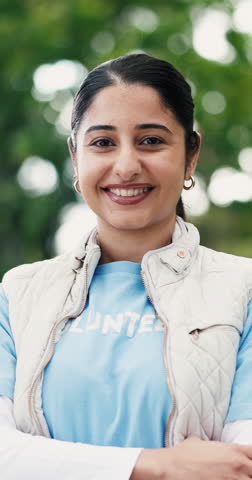 Face, volunteer and woman laugh at park for community service, non profit and arms crossed. Outdoor, charity worker and confident person with NGO, social responsibility and funny portrait with bokeh