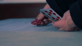 Poker playerwith winning flush hand in card game close up 4k slow motion shot selective focus - Powered by Shutterstock - Get 15% off with code: PIKWIZARD15