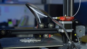 A 3D printer creates a plastic prototype using additive manufacturing in a clean and organized workspace with no human presence. - Powered by Shutterstock - Get 15% off with code: PIKWIZARD15