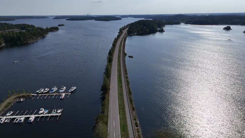 Beautiful aerial view of a Finnish road between the lakes.