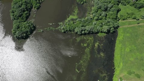 Drone Taking Off above River near Bridge