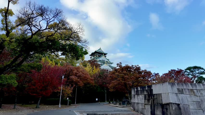 Osaka Castle Surrounded by Moat and Autumn Foliage