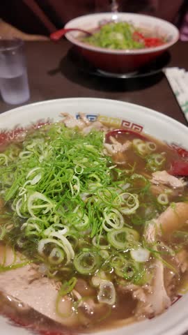 Traditional Japanese ramen bowl with green onions