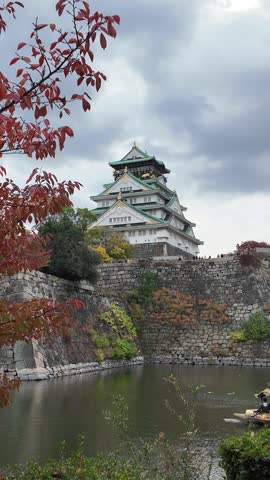 Osaka Castle Surrounded by Moat and Autumn Foliage