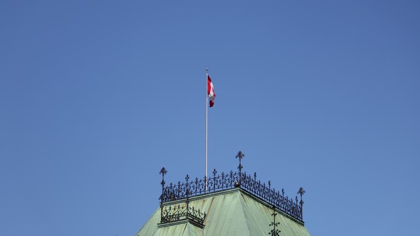 Parliament Hill, East Block building roof with Canadian flag in Ottawa, Canada