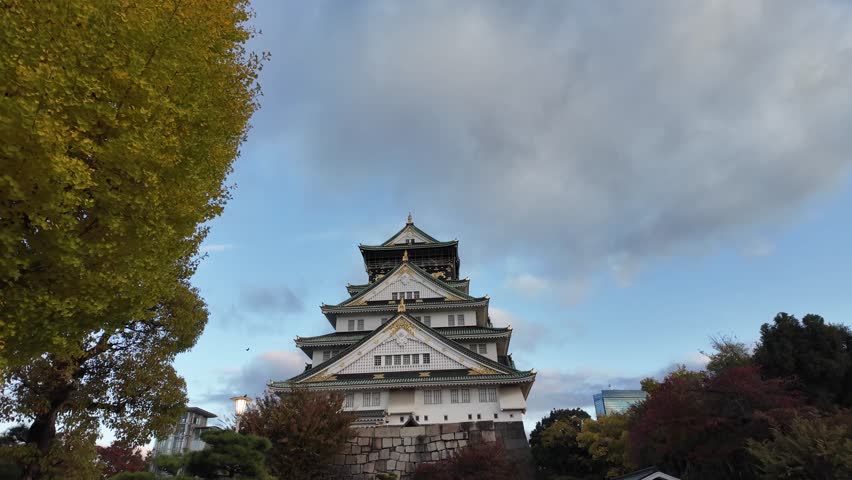Osaka Castle Surrounded by Moat and Autumn Foliage