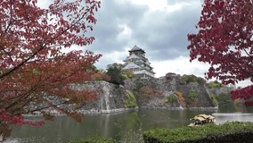 Osaka Castle Surrounded by Moat and Autumn Foliage - Powered by Shutterstock - Get 15% off with code: PIKWIZARD15