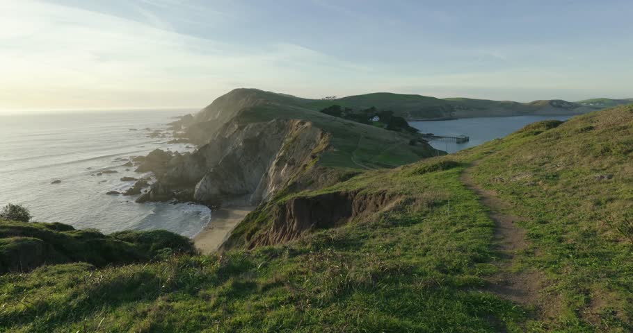 Scenic hiking trail along the rugged cliffs of Point Reyes at sunset