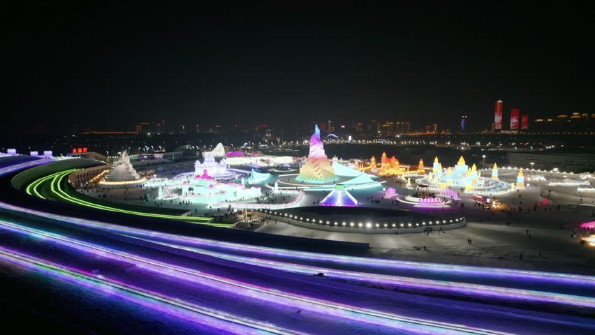 This 4K aerial time-lapse video presents Harbin’s distinctive charm, blending modern CBD architecture, historic Saint Sophia Cathedral, Grand Theatre, magical Ice-Snow World with grand bridges and smooth urban traffic flow. It captures the perfect fusion of cultural landmarks, winter ice-snow scenery and dynamic urban traffic in northern China’s iconic ice city, perfect for tourism promotion and winter urban content.