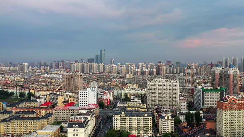 This 4K aerial time-lapse video presents Harbin’s distinctive charm, blending modern CBD architecture, historic Saint Sophia Cathedral, Grand Theatre, magical Ice-Snow World with grand bridges and smooth urban traffic flow. It captures the perfect fusion of cultural landmarks, winter ice-snow scenery and dynamic urban traffic in northern China’s iconic ice city, perfect for tourism promotion and winter urban content.