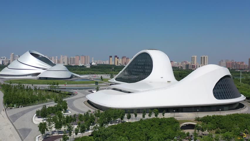 This 4K aerial time-lapse video presents Harbin’s distinctive charm, blending modern CBD architecture, historic Saint Sophia Cathedral, Grand Theatre, magical Ice-Snow World with grand bridges and smooth urban traffic flow. It captures the perfect fusion of cultural landmarks, winter ice-snow scenery and dynamic urban traffic in northern China’s iconic ice city, perfect for tourism promotion and winter urban content.