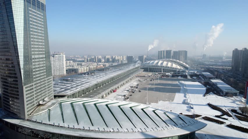 This 4K aerial time-lapse video presents Harbin’s distinctive charm, blending modern CBD architecture, historic Saint Sophia Cathedral, Grand Theatre, magical Ice-Snow World with grand bridges and smooth urban traffic flow. It captures the perfect fusion of cultural landmarks, winter ice-snow scenery and dynamic urban traffic in northern China’s iconic ice city, perfect for tourism promotion and winter urban content.
