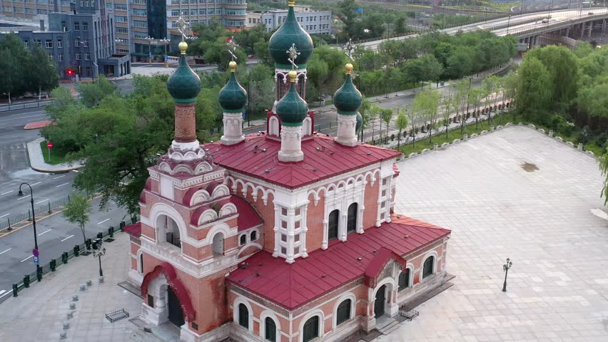 This 4K aerial time-lapse video presents Harbin’s distinctive charm, blending modern CBD architecture, historic Saint Sophia Cathedral, Grand Theatre, magical Ice-Snow World with grand bridges and smooth urban traffic flow. It captures the perfect fusion of cultural landmarks, winter ice-snow scenery and dynamic urban traffic in northern China’s iconic ice city, perfect for tourism promotion and winter urban content.