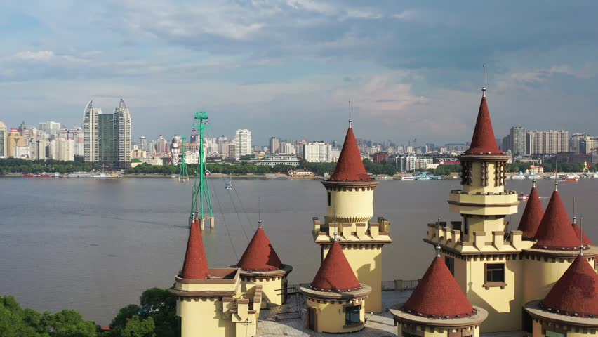 This 4K aerial time-lapse video presents Harbin’s distinctive charm, blending modern CBD architecture, historic Saint Sophia Cathedral, Grand Theatre, magical Ice-Snow World with grand bridges and smooth urban traffic flow. It captures the perfect fusion of cultural landmarks, winter ice-snow scenery and dynamic urban traffic in northern China’s iconic ice city, perfect for tourism promotion and winter urban content.