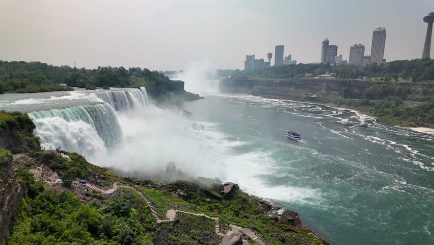 American falls at niagara falls with cityscape