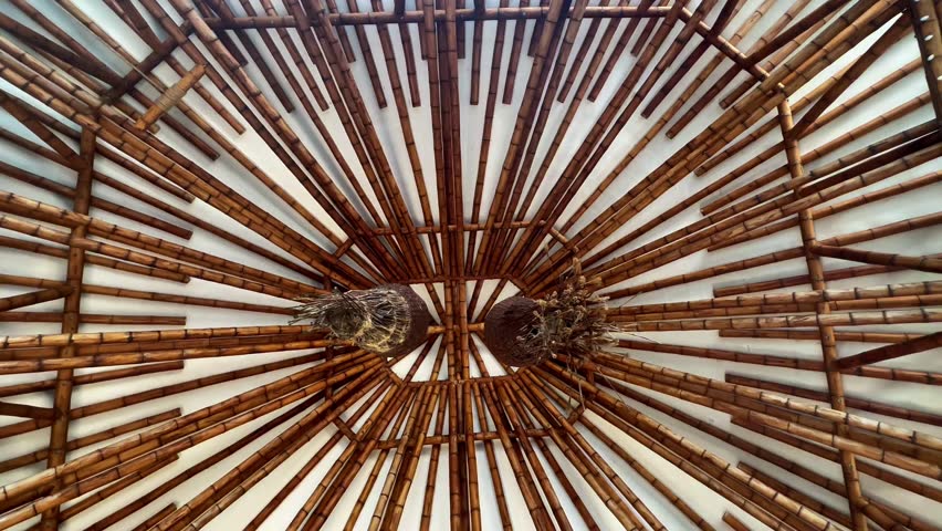 Interior view of bamboo ceiling structure with hanging lamps