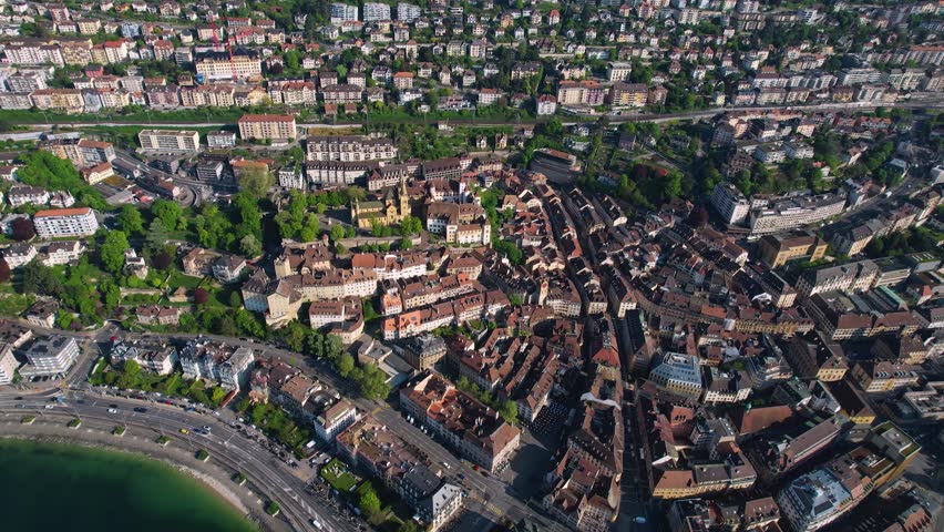 Panoramic aerial of the old town of the city Neuchâtel in Switzerland on a sunny noon in summer