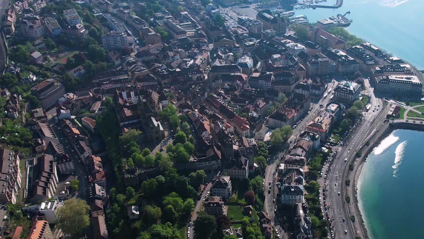 Panoramic aerial of the old town of the city Neuchâtel in Switzerland on a sunny noon in summer