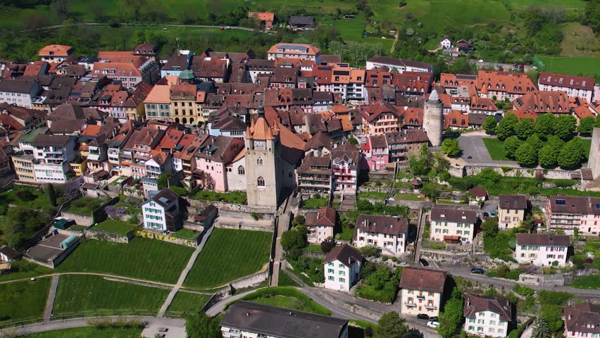 A panoramic aerial view around the old town of the city Orbe in Switzerland on a sunny spring noon
