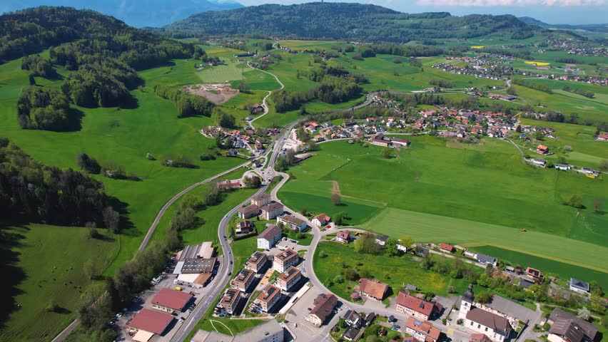 A panoramic aerial view around the old town of the city Remaufens in Switzerland on a sunny spring noon
