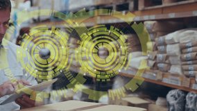 A warehouse manager using a tablet pc to manage warehouse operations. Global shipping delivery and connections concept digitally generated video. - Powered by Shutterstock - Get 15% off with code: PIKWIZARD15