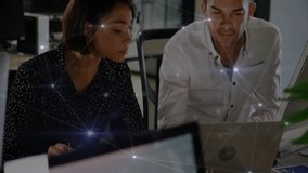 Animation of network transferring data over diverse male and female colleague talking at office. Business, connection, teamwork, digital interface and communication, digitally generated video. - Powered by Shutterstock - Get 15% off with code: PIKWIZARD15