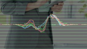 Upon tapping tablet screen, woman animating line graph with peaks and troughs showing data trends. Analytics, data, technology, innovation, modern, professional, digital - Powered by Shutterstock - Get 15% off with code: PIKWIZARD15