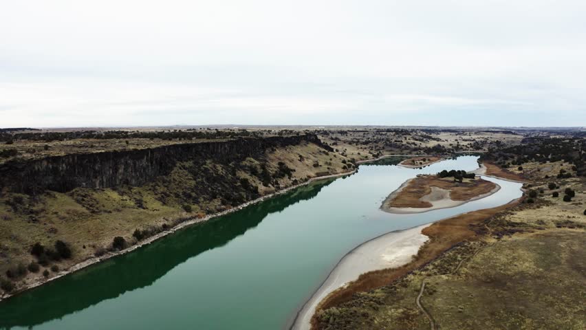 Drone shot pulling away from the Snake River as it winds through Idaho