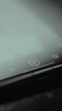 Finger taps the PAUSE and PLAY buttons for a video on the mobile phone screen - Powered by Shutterstock - Get 15% off with code: PIKWIZARD15