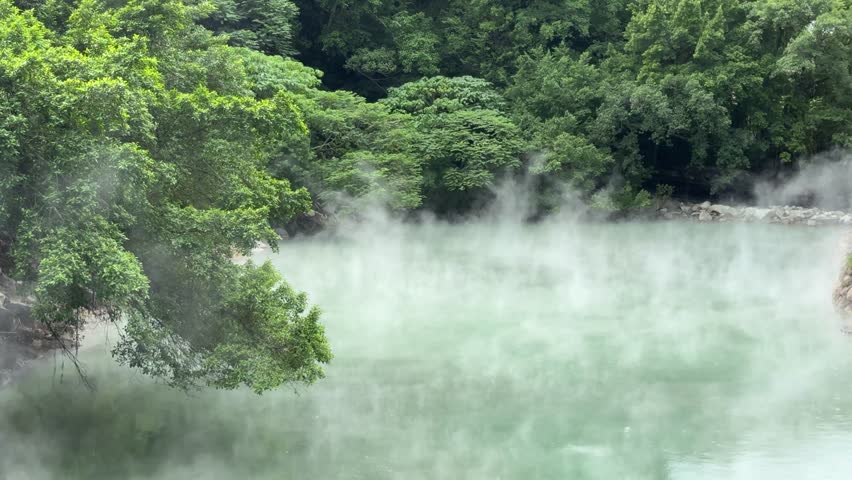 Steam rising from natural hot spring water, showcasing geothermal activity in a peaceful outdoor environment.
Relaxing nature scene with warm thermal water and subtle motion of steam.