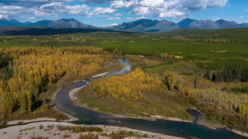 Cloud Shadows Over A Creek outside Glacier National Park, Montana Winding Through Autumn Trees. Timelapse