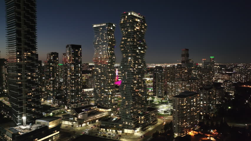 Night view of M City Condos in downtown Mississauga, vibrant cityscape