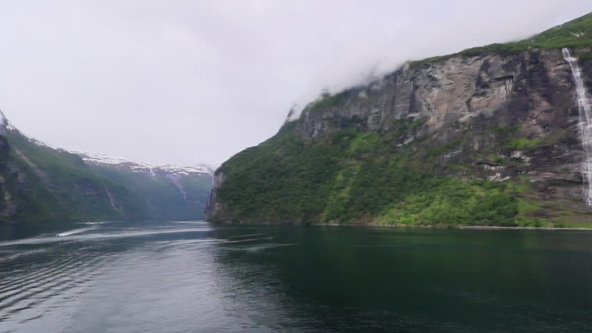 Iconic seven sisters waterfall cascading down steep cliffs in Geirangerfjord Norway