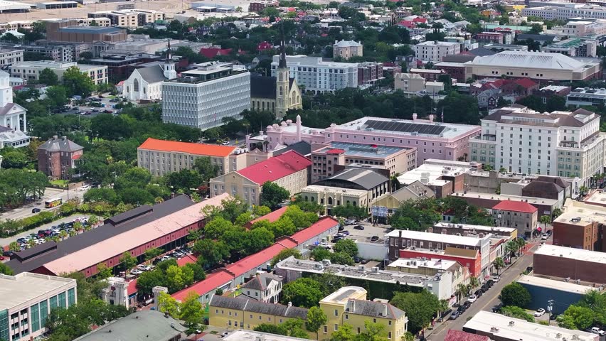Aerial view of city landscapes of coastal Charleston, South Carolina downtown skyline showcasing lowcountry metropolitan neighborhood scenery - 4K Drone