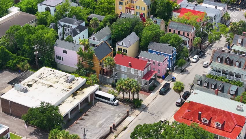 Aerial view of houses in neighborhood of coastal Charleston, South Carolina downtown showcasing lowcountry metropolitan scenery landscape - 4K Drone